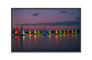 colorful glowing sailboats at twilight